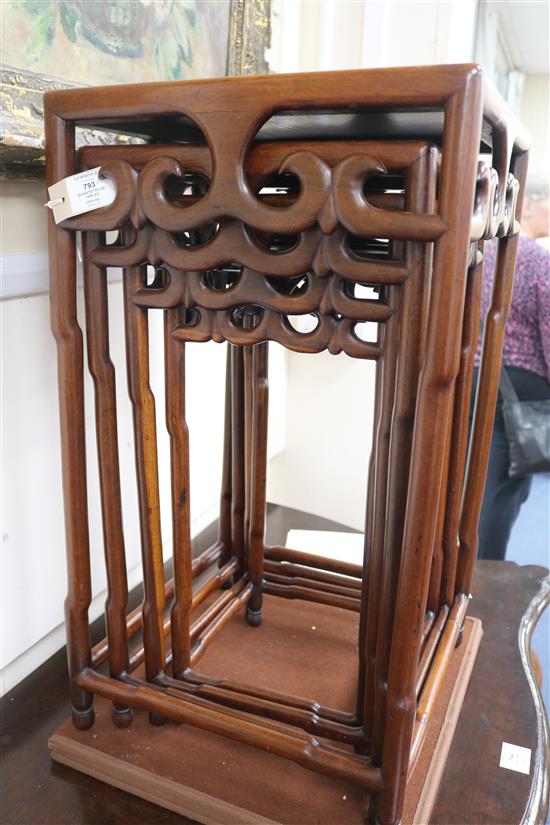 A quartetto of Chinese hardwood occasional tables, the square tops with pierced scrolled friezes